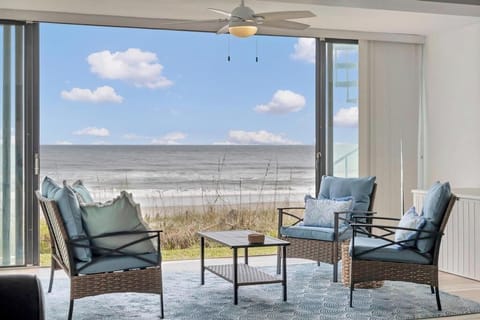 Sit back in comfy balcony seating & take in uninterrupted ocean views just beyond the dunes.