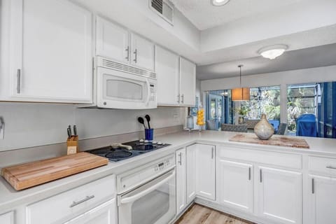 Contemporary kitchen layout designed for both cooking & gathering.