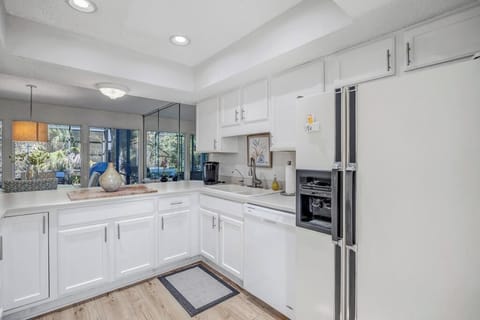 Contemporary kitchen layout designed for both cooking & gathering.