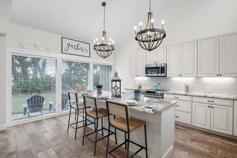 Light-filled dining nook w/ a cozy table, great for shared meals and morning coffee.