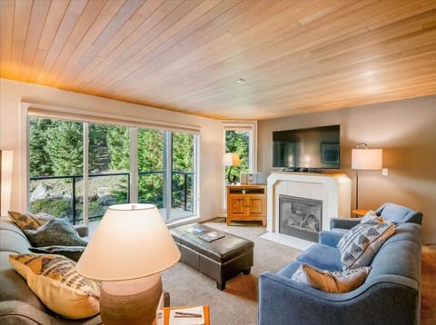 Relax in our spacious living room and take in the beautiful view outside. In the evenings, unwind by watching your favorite show on the TV, sipping your preferred wine, and enjoying the warm glow of the fireplace.