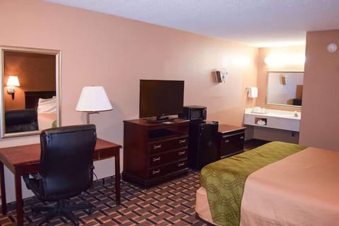 Stretch out in a spacious room with desk, TV, and comfort.