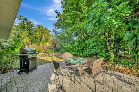 Relaxing patio surrounded by greenery and fresh air.