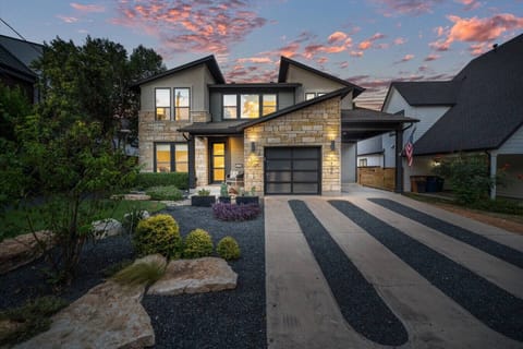 House#1: Serene house exterior glowing at sunset, radiating warmth and timeless charm.