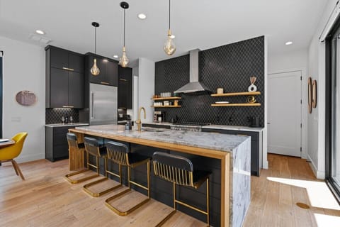 Modern kitchen with a large island and all the essentials for easy meal prep.