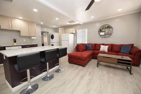 Main living room off front door. Area includes use of washer/dryer and standard kitchen appliances. Note: microwave was added after photos were taken