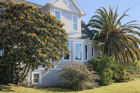 Welcome to your home away from home! Our charming Victorian-style cottage is framed by blooming trees and lush greenery, offering a peaceful retreat from the moment you arrive