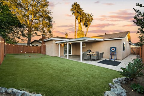 Fenced backyard where children can enjoy outdoor fun safely.