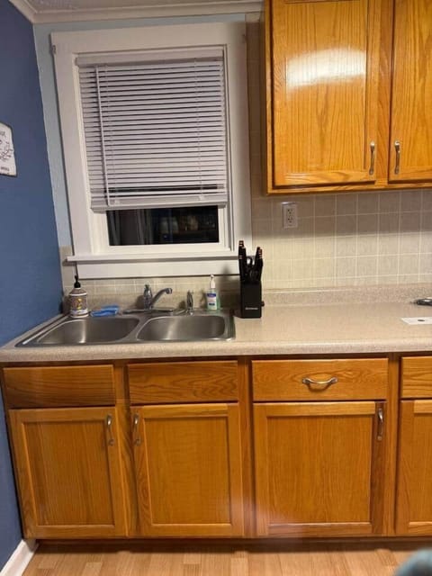 Kitchen sink and cabinets with dishware