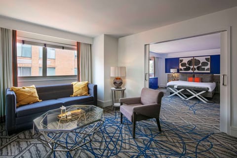 Settle in with big windows, TV, and generous dresser space.
