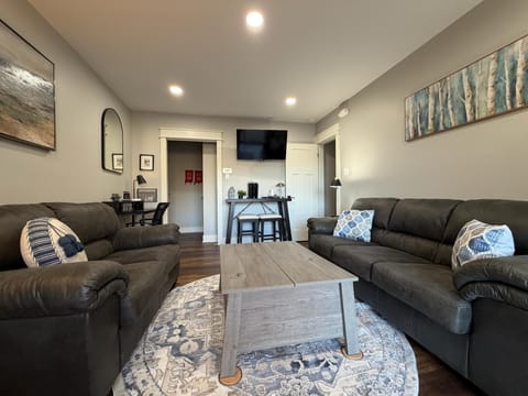 Cozy pullout couch converts into a full-size bed, providing a comfortable extra sleeping space.