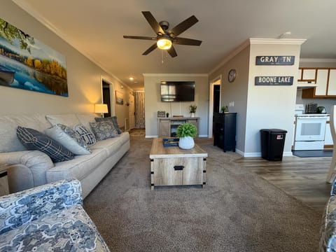 Bright and inviting, this living room combines comfort with convenience with a smart TV at your fingertips.