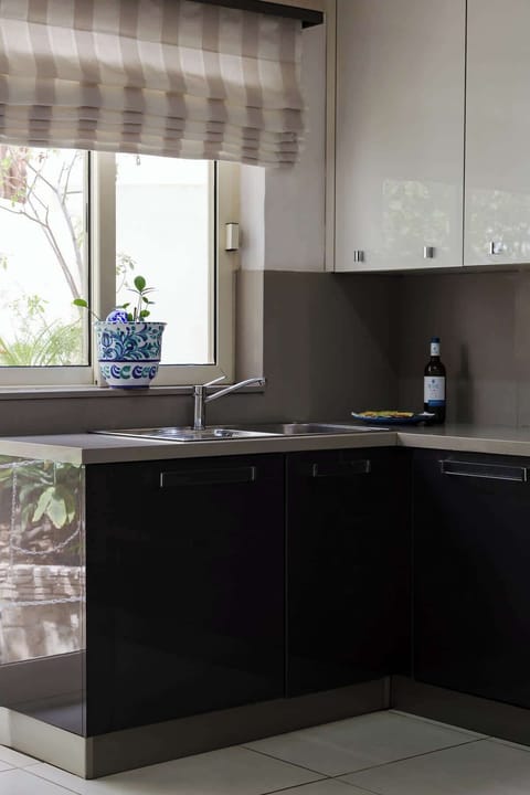 A sunlit kitchen corner brings a touch of the outdoors inside. Bright, cheerful, and perfect for preparing meals.