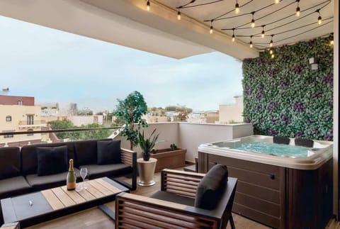 Enjoy a peaceful retreat on the balcony, complete with a bubbling jacuzzi, stylish lounge area, and serene views. Perfect for morning coffee or evening celebrations.