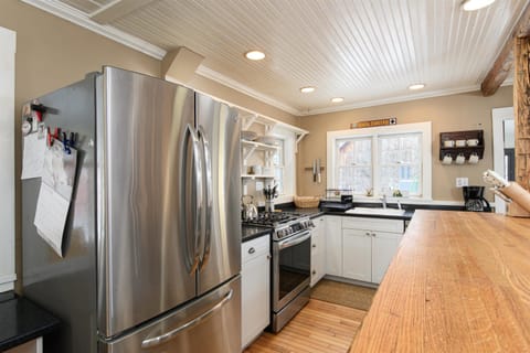 Your fully equipped kitchen features stainless steel appliances, granite countertops, and warm wood accents - everything you need to prepare meals during your stay.