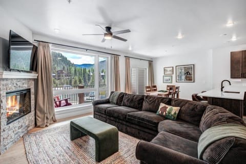 Breathtaking mountain views can be enjoyed from the comfort of the living area, enhancing the serene ambiance of this modern condo.