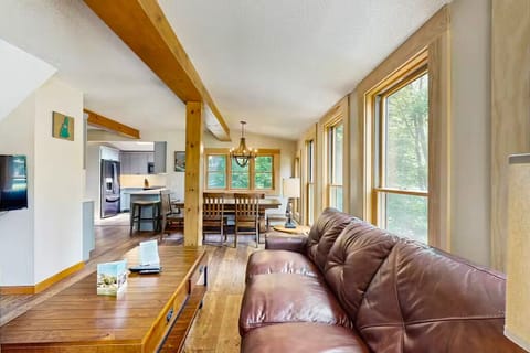 Bright, rustic living space with forest views—perfect North Conway retreat.