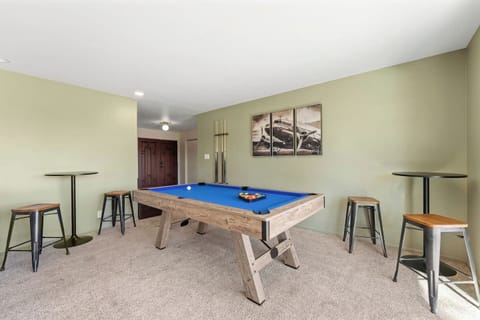 Game room setup featuring a full-size pool table.