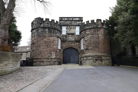 Historic castle entrance with charming stone towers and archway