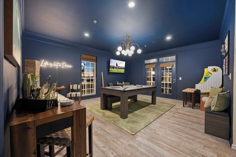 Moody game room made for playing pool, arcade games, and unforgettable nights.