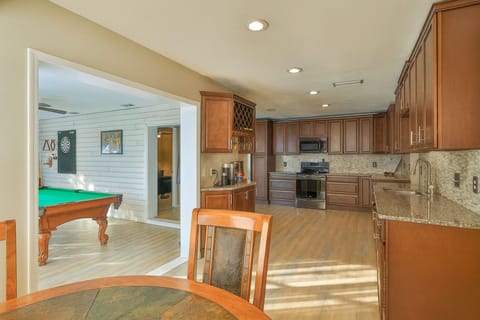 Beautiful Modern kitchen with access to Game Room, Coffee bar, and living room.