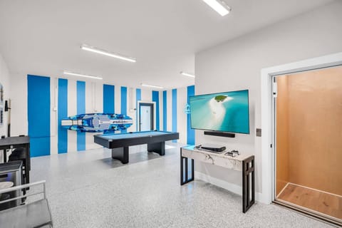 Ultimate game room. Pool table, Play Station, Basketball, Darts, Magnetic Board Games, Roku TV and a Sonos Sound System! Elevator access for all 3 floors.