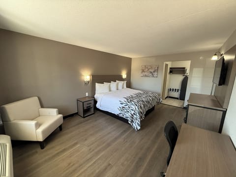 Unwind in a spacious king bedroom with calming, modern style.