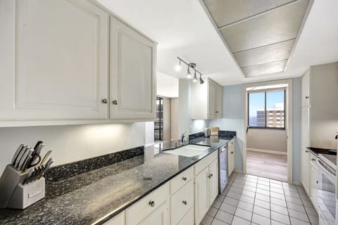 The kitchen is highlighted by the units natural lighting. There is ample cabinet storage, cookware, plenty of counterspace.
