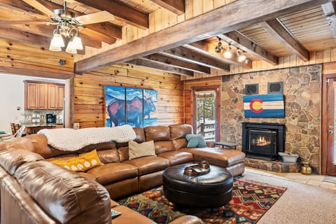 Living room: 65” Smart TV with streaming, wood-burning fireplace, radiant heat
