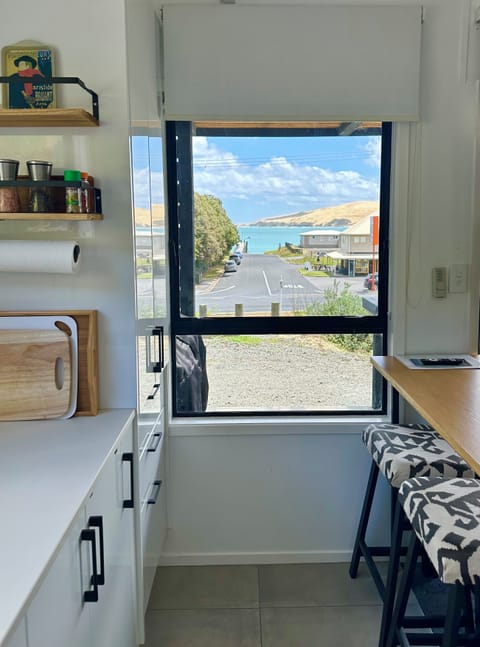 Studio kitchen with view to the boat ramp and wharf