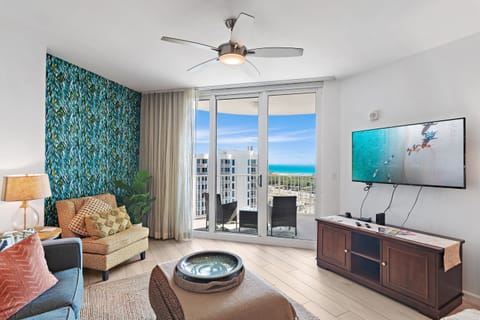 Unwind in this vibrant living room, letting the soft breeze from the balcony refresh you as you soak in stunning ocean views.