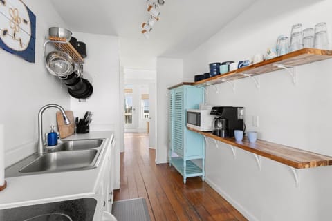 Looking back to foyer through kitchen
