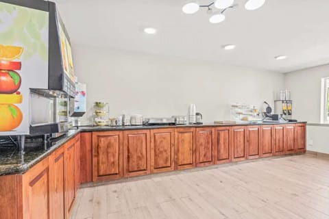 Self-serve breakfast bar with waffle maker and juice machine