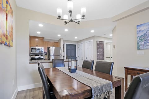 Gather around your spacious dining table for memorable meals, with the fully-equipped kitchen just steps away for easy entertaining and family time.