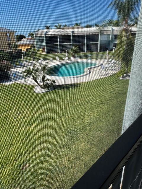 Pool outside your screened porch. 2nd building other side of pool