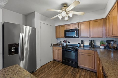 Stainless fridge, Kitchenaid mixer, and all the gadgets—this kitchen makes family meals or snacks a breeze at your lakeside retreat.