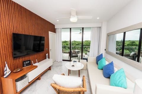 Living room: cozy and bright living/dinning room, Sofa + Smart TV.