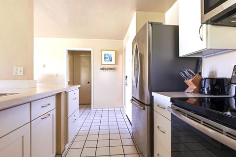 Kitchen with fridge, stove microwave and everything you need