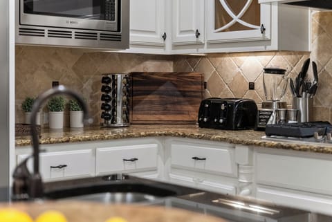 Spices, cutting board, toaster in kitchen