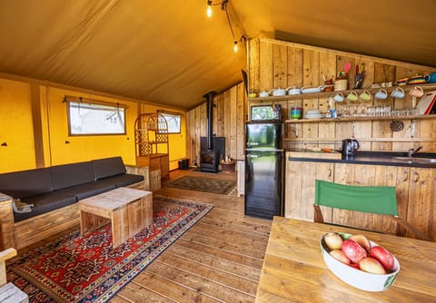 Spacious open-plan kitchen, dining and sitting area with a log burner