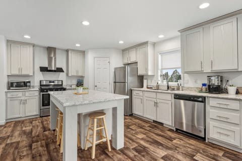 Spacious kitchen has a large island and lots of counterspace. 