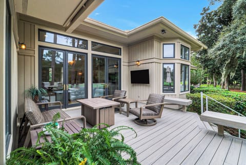 A beautifully landscaped exterior sets the tone for this inviting Lowcountry retreat.