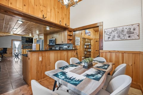 Comfortable dining space with classic New Hampshire cabin style.