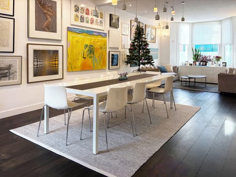 Open-plan living and dining area with high ceilings and plenty of natural light.