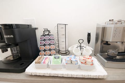 A selection of creamers, sugars, sweeteners, hot chocolate, and assorted teas 