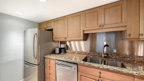 Cozy kitchen with granite countertops and stainless steel appliances