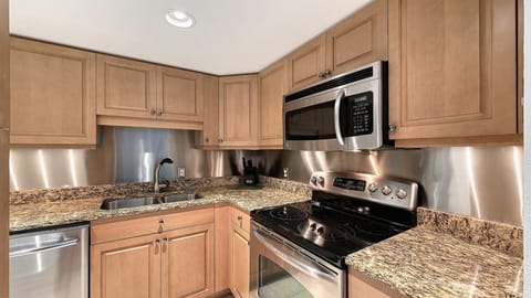 Modern kitchen with granite countertops and stainless steel appliances