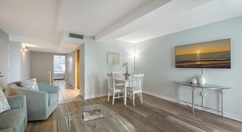 Bright and airy living room with cozy seating and dining area