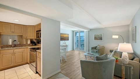 Cozy living room and kitchen with serene city views