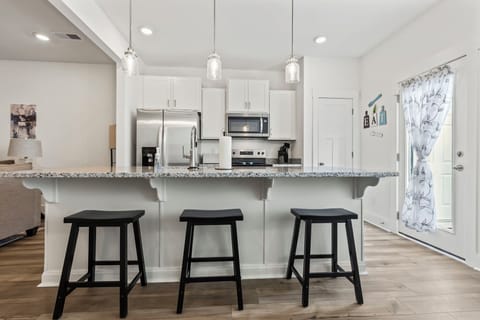 Kitchen island with bar stools